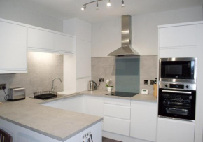 Beautifully refurbished 2 bedroom self-contained apartment with secure parking